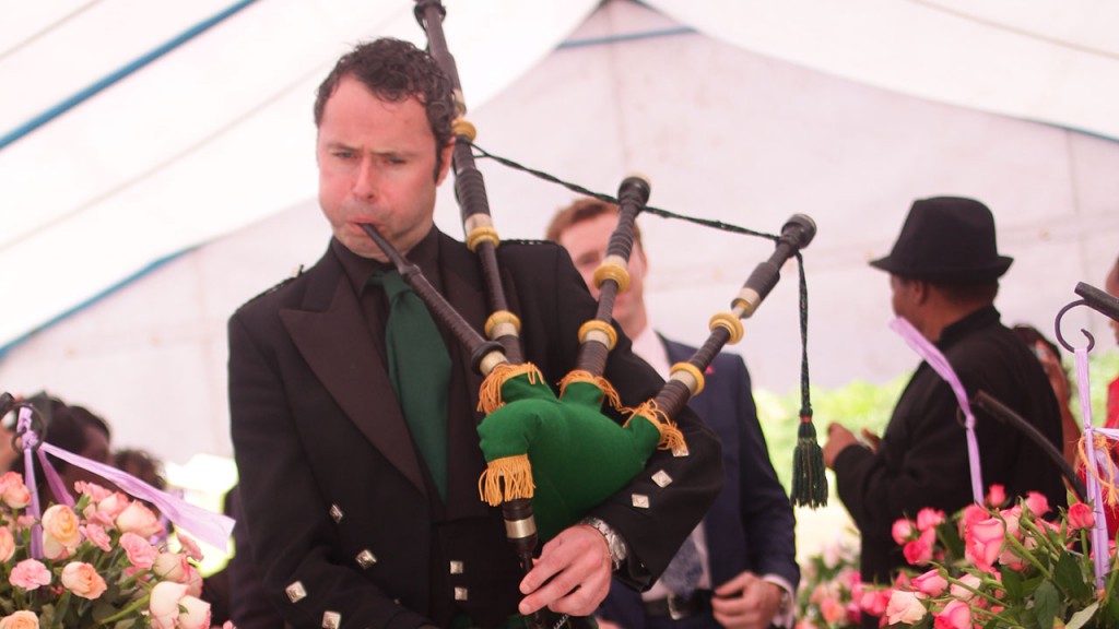 John Manners playing the bagpipes